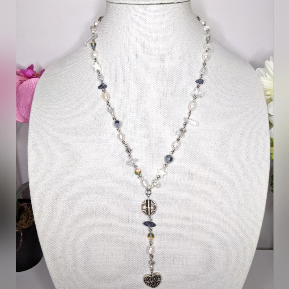 Necklace with pearls and heart pendant and is long and gray. Handmade by me.